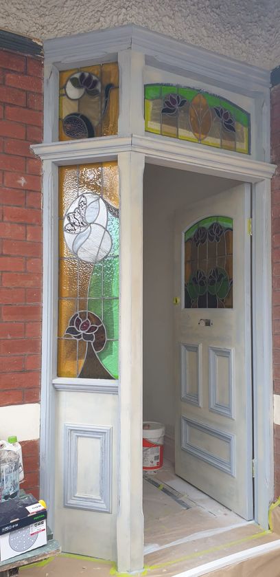 External photo of the entrance door after a layr of paint
