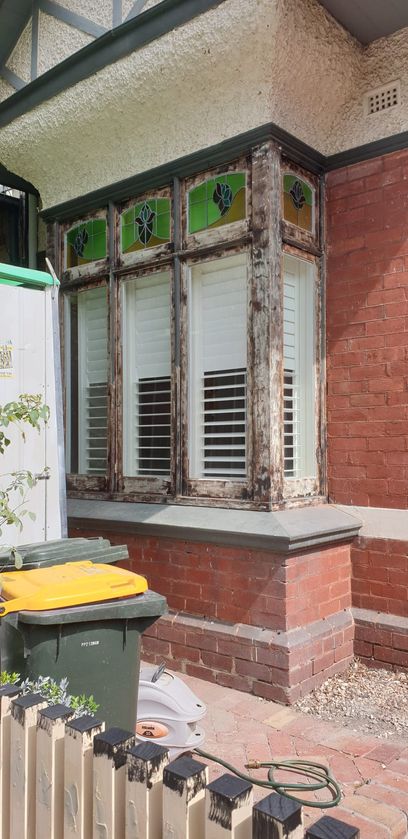 External photo of the wooden window frame before the job