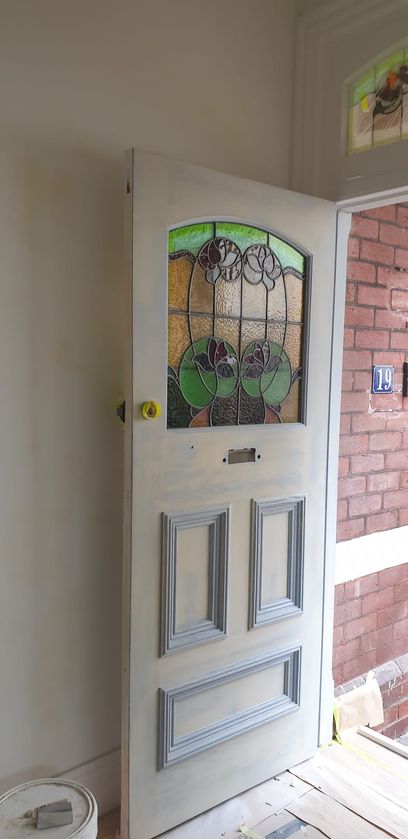 Photo of the open entrance door from the inside after a layer of paint