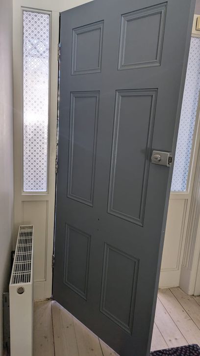 Photo of the painted inside side of the entrance door