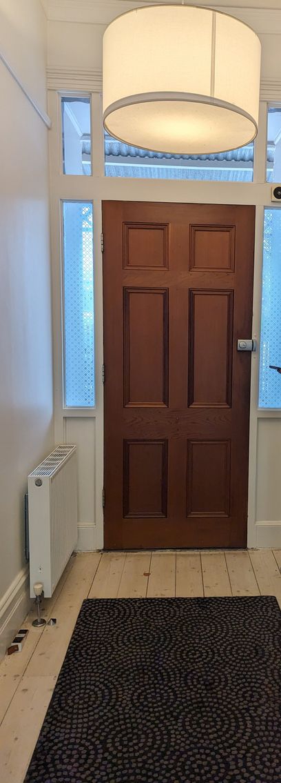 'Before' photo of the inside of the entrance door